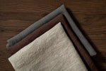 linen towels in the 3 varieties of color, grey, pale sandy and brown