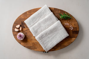 
                  
                    Load image into Gallery viewer, striped linen tea towels on the oak wood cutting board
                  
                