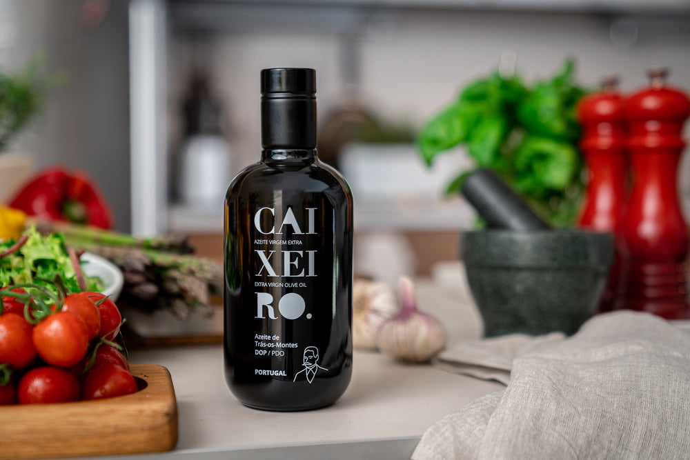 
                  
                    Load image into Gallery viewer, extra virgin olive oil in a black 500ml bottle in the kitchen, product of Portugal
                  
                